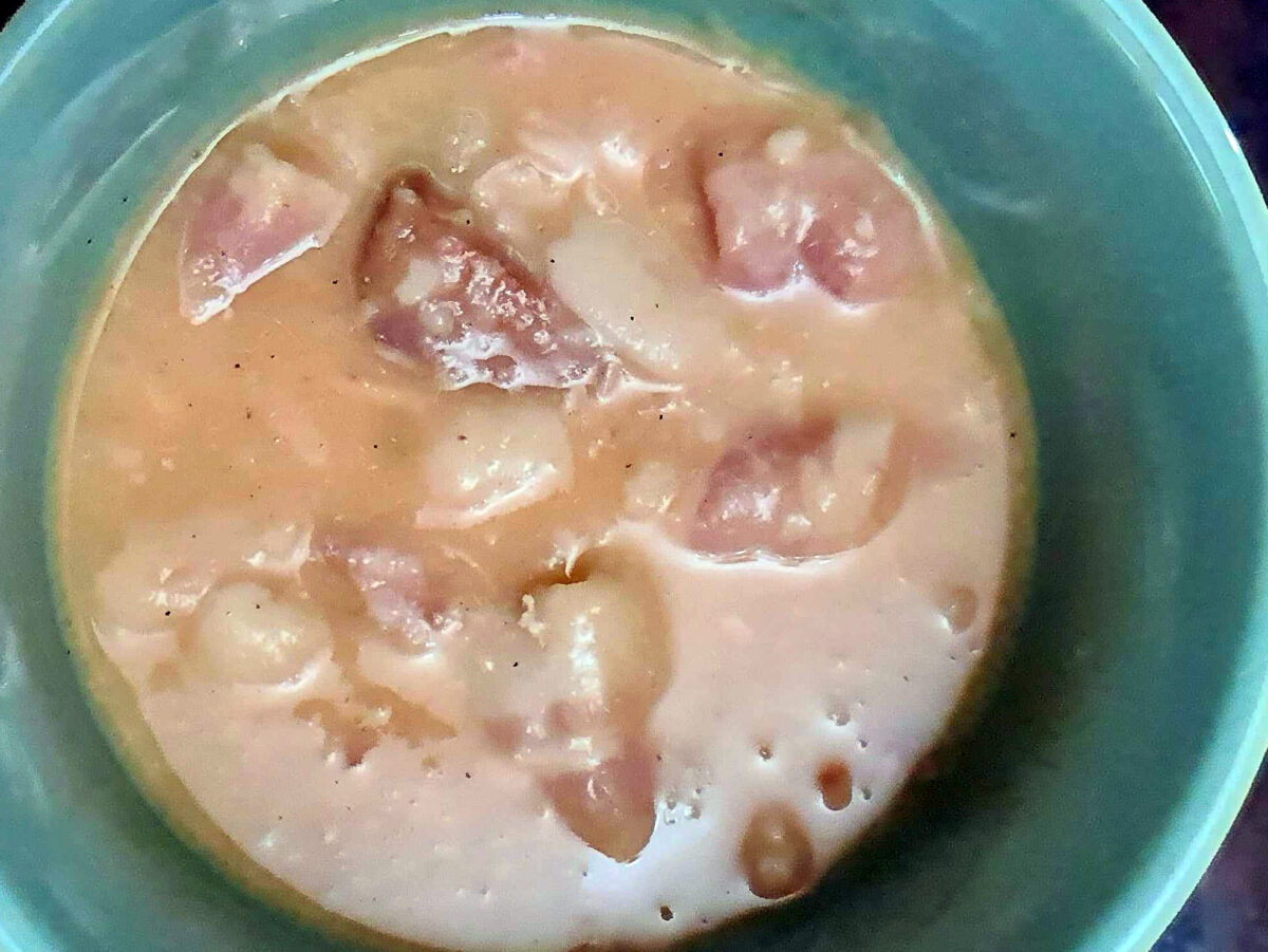bowl of fabada, a stew made of beans and pork chorizo