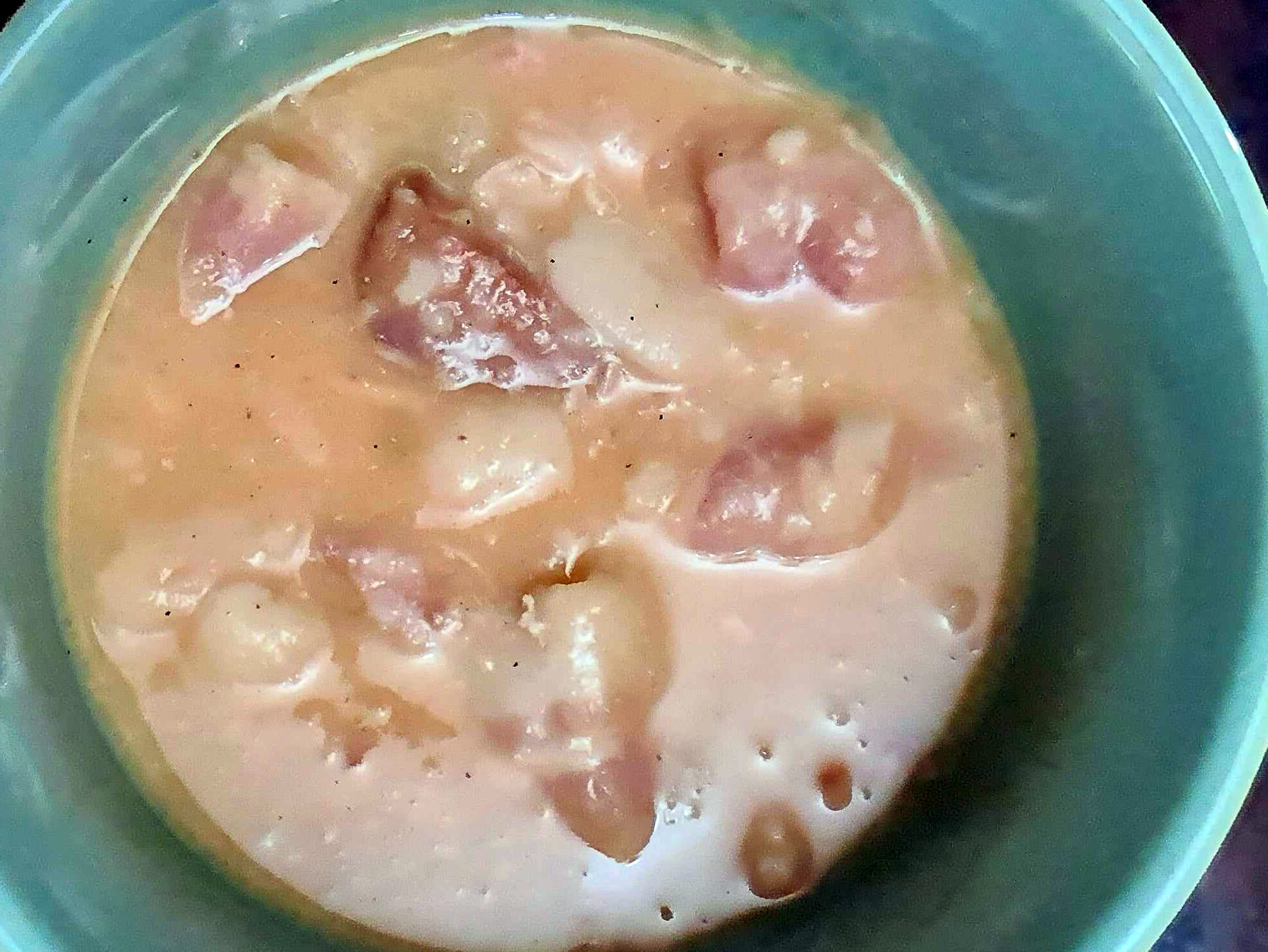 bowl of fabada, a stew made of beans, Spanish chorizo and pork hocks